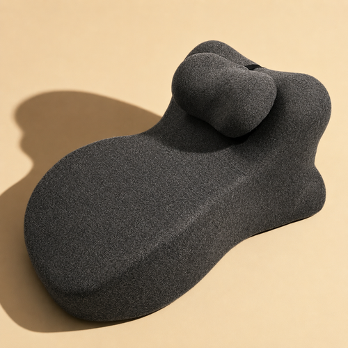 The Duet Pillow in black, shown on a warm cream background
