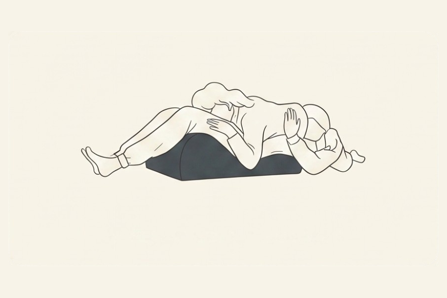 Line drawing: a couple using the Amoret pillow, position 4 of 6, from the Four-Sunday Sex Reset