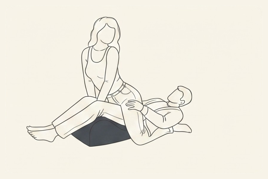 Line drawing: a couple using the Amoret pillow, position 5 of 6, from the Four-Sunday Sex Reset